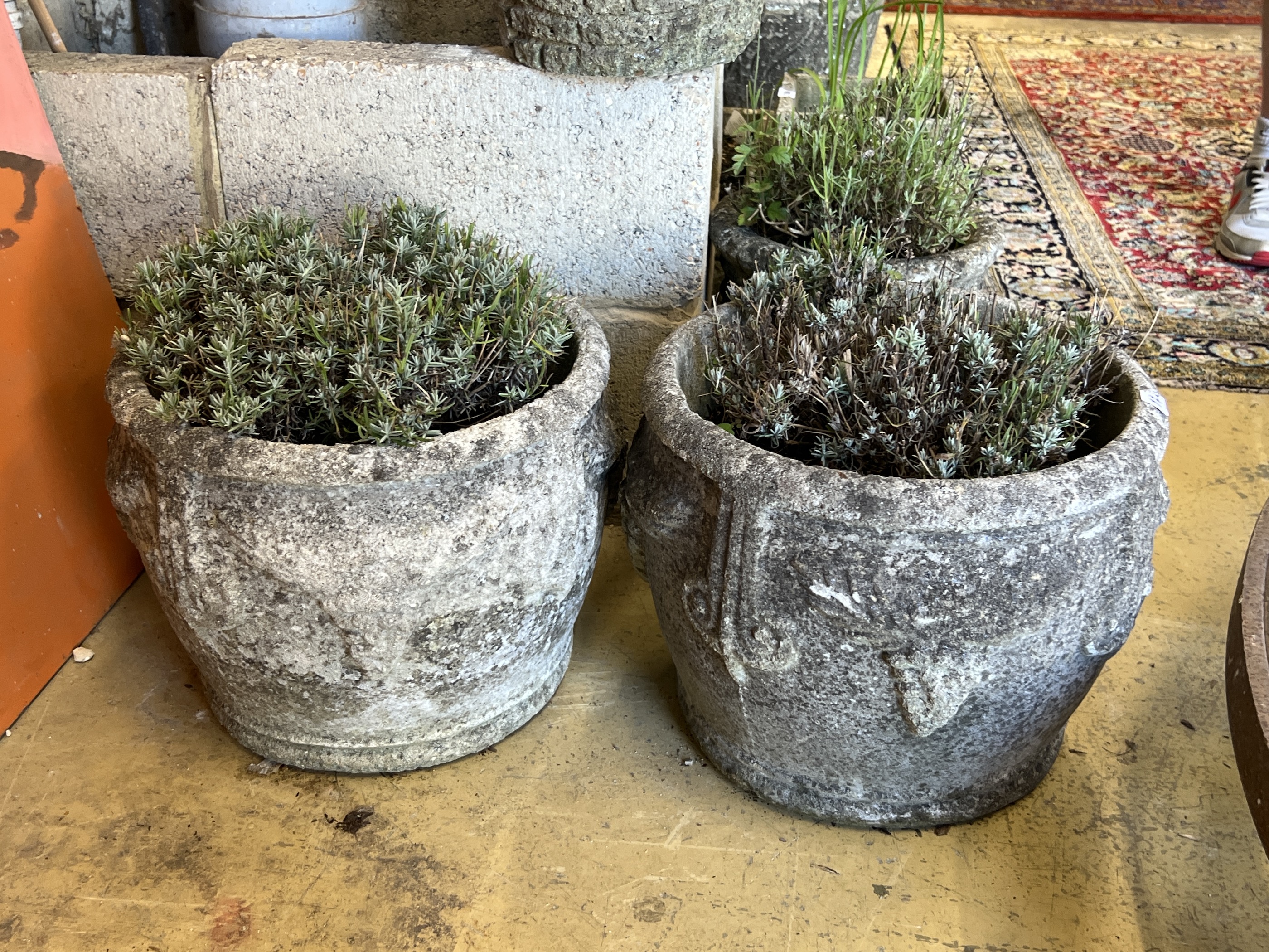 A pair of circular reconstituted stone garden planters, diameter 38cm, height 30cm